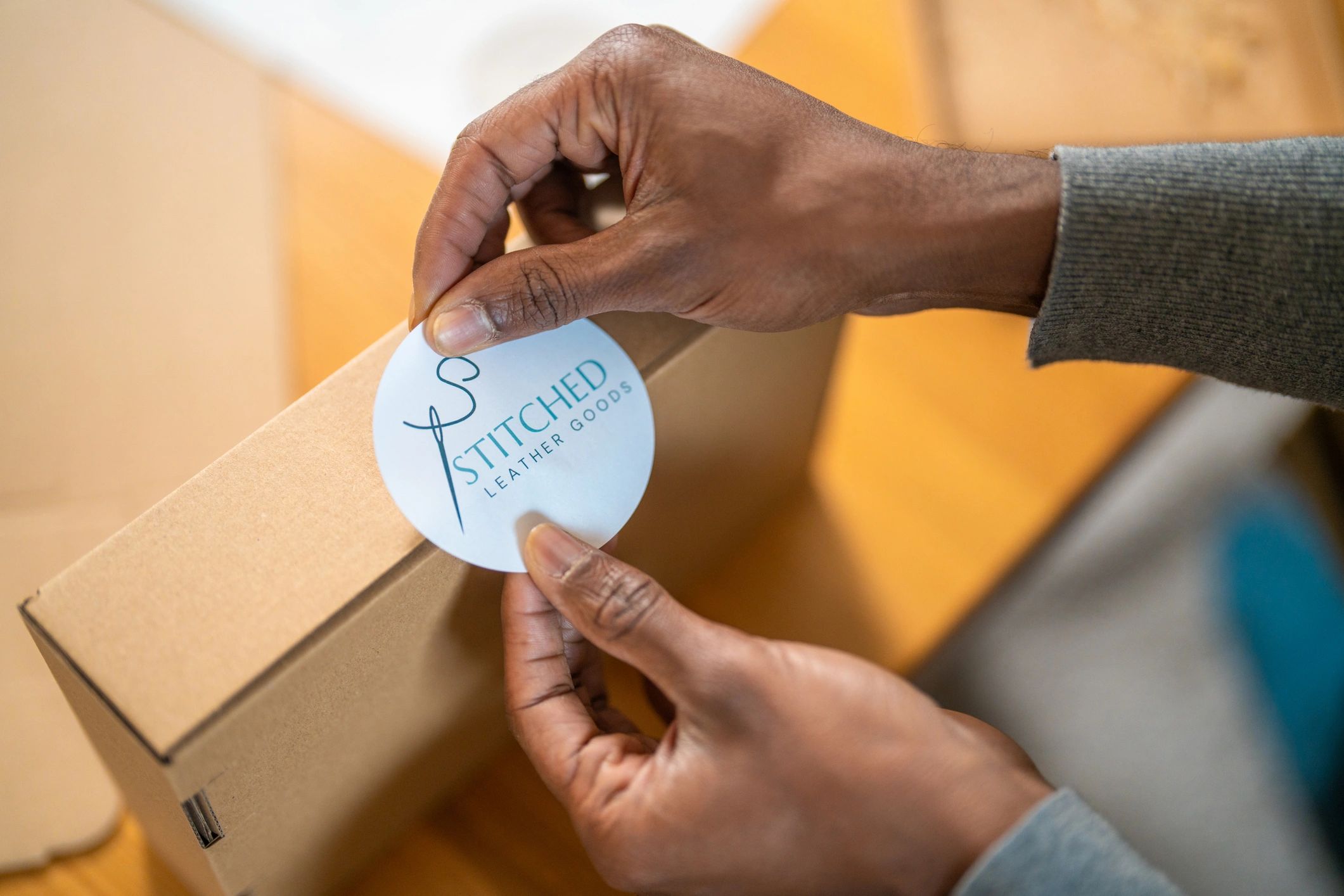 Small business workspace packing products for shipment (order fulfillment).